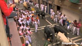 Running of the bulls in Spains Pamplona begins [upl. by Ayor]