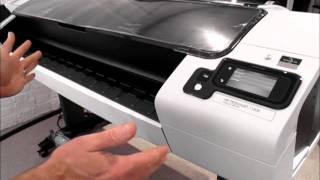 HP Designjet T1300 printer  how to load rolls of media [upl. by Dnaltroc]